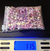 Pink and gold rhinestones in clear bag on digital scale, 115g, for tumbler bling crafting