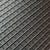 Close-up of a sparkly black rhinestone tray from the tumbler universe. textured surface with a repeating diamond grid pattern.