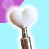 White heart-shaped tumbler flipper tool for rhinestone crafting with metallic handle
