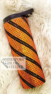 Orange and black rhinestone tumbler with striped pattern, perfect for bling crafting projects.
