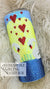 Bling tumbler with red heart rhinestones, blue and yellow gradient, white daisy design on fluffy background