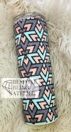 Rhinestone tumbler with blue, pink, and purple leopard print design on fluffy white background