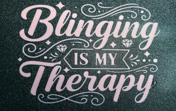 Text 'Blinging is my Therapy' with decorative elements on a textured background