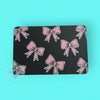 rhinestone case with pink bow pattern on a turquoise background