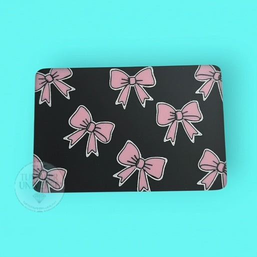 rhinestone case with pink bow pattern on a turquoise background