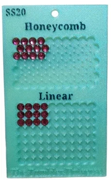 SS20 red rhinestones in honeycomb and linear patterns on teal display card for tumbler crafting
