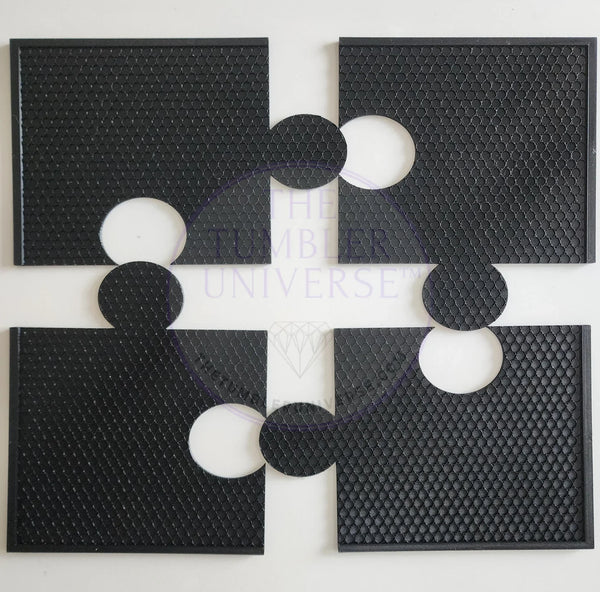 Black textured tumbler grip pads with circular cutouts for secure handling during rhinestone crafting