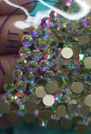 Iridescent rhinestones and flatback gems for crafting, perfect for bling projects and tumbler designs.