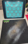 Rhinestone tumbler template with flatback flipper design, featuring colorful rhinestones on a black mesh mat for crafting.