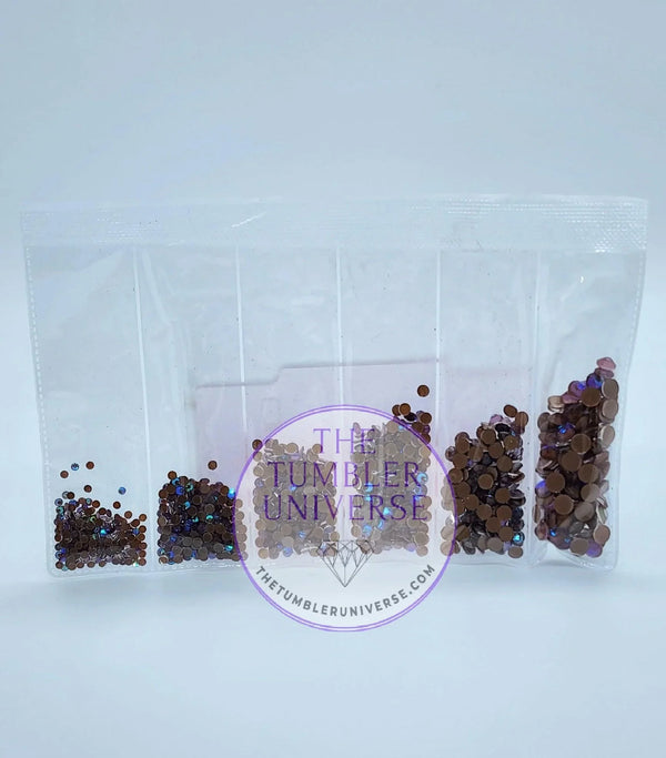 Clear bag with five compartments of iridescent rhinestones for tumbler bling, crafting, and DIY projects