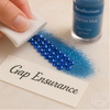 Blue rhinestones and marine blue glitter with Gap Assurance label for crafting projects